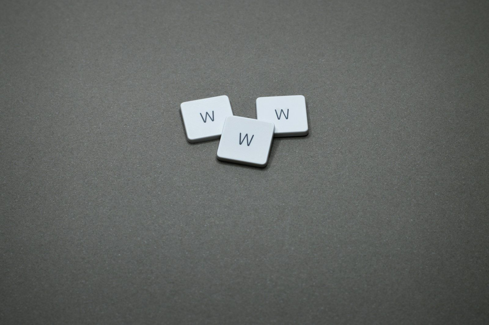 Three tiles with the letter "w" on them.